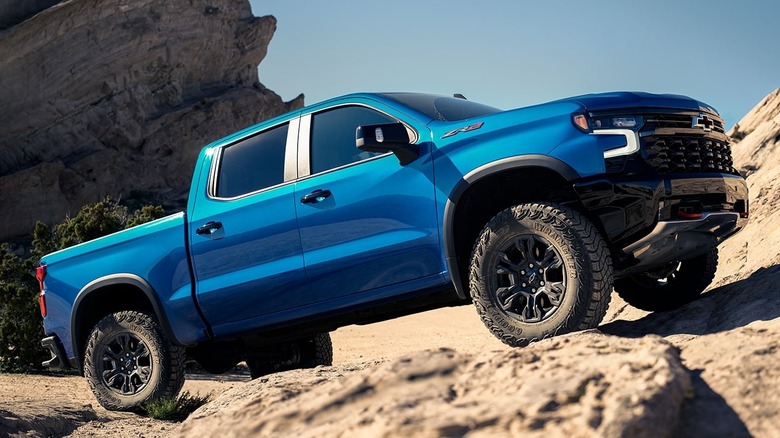 The 2025 Chevrolet Silverado driving on off-road desert terrain