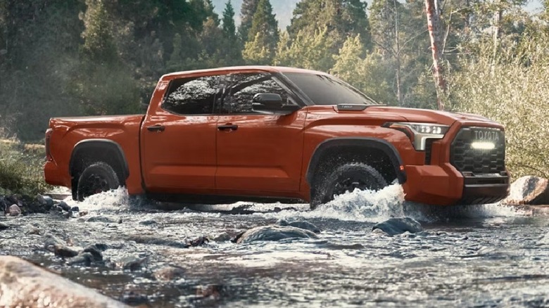 Toyota Tundra crossing a stream