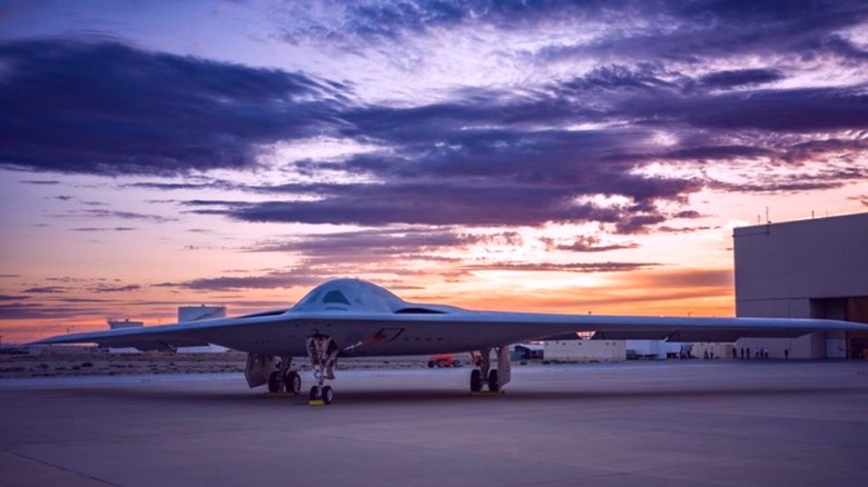 B-21 Raider outside hanger sunrise