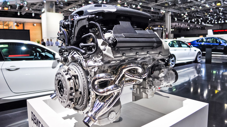 S65 engine on display in an automotive showroom