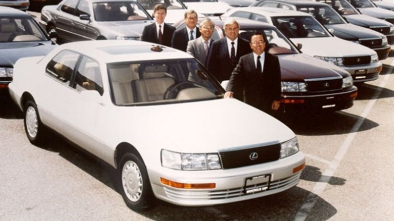 Staff posing with Lexus LS 400