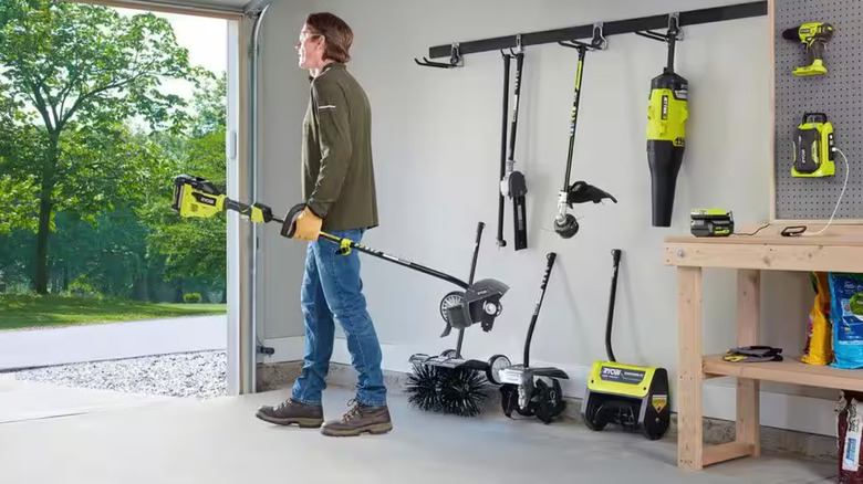 Person using the Ryobi power head with an attachment