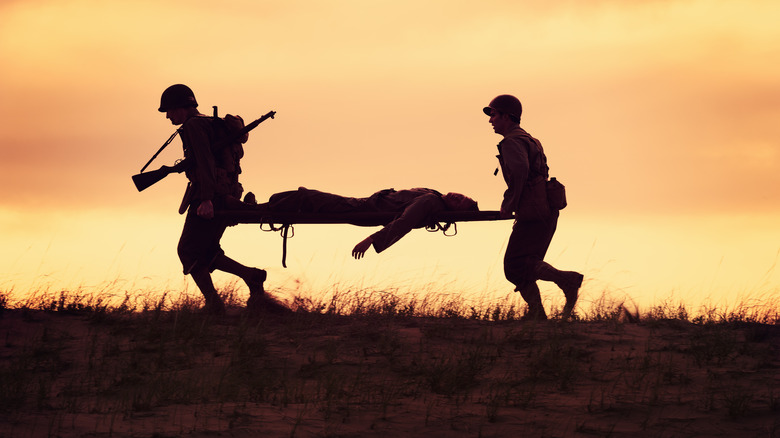 WWII Medics carrying wounded soldier