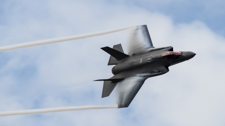 F-35 stealth fighter jet with jet stream