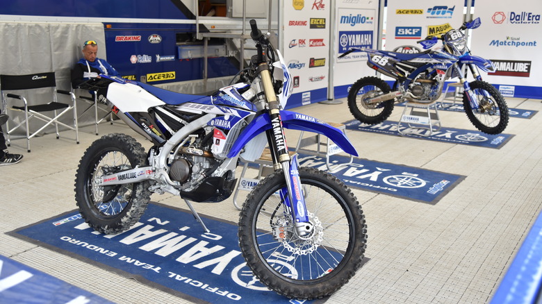 2 yamaha dirt bikes in paddock