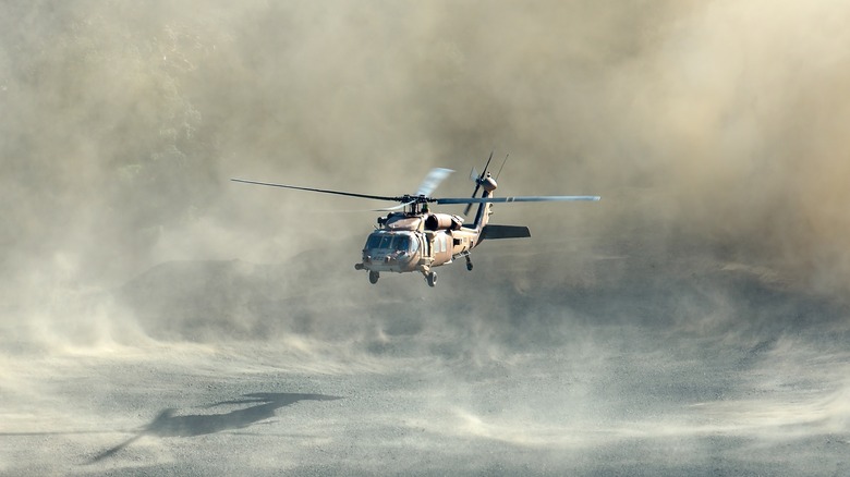 Black Hawk helicopter in dusty air