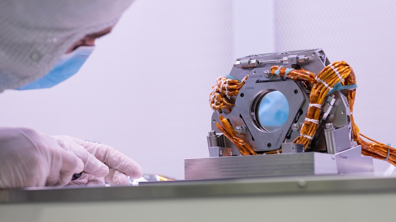 Engineer examines part of the coronagraph