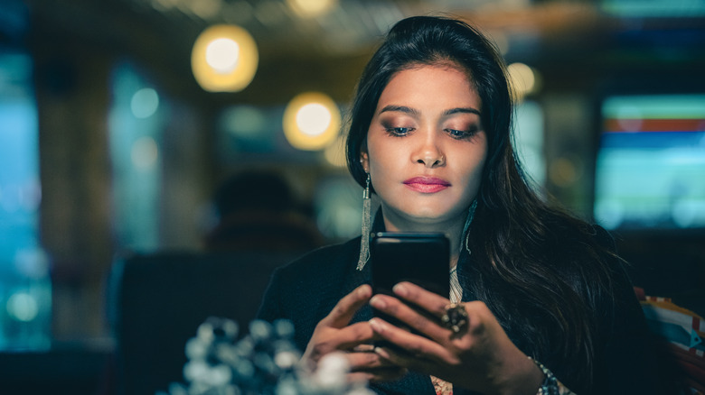 woman looking at phone