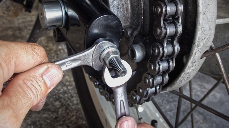 two wrench adjustment of motorcycle chain slack