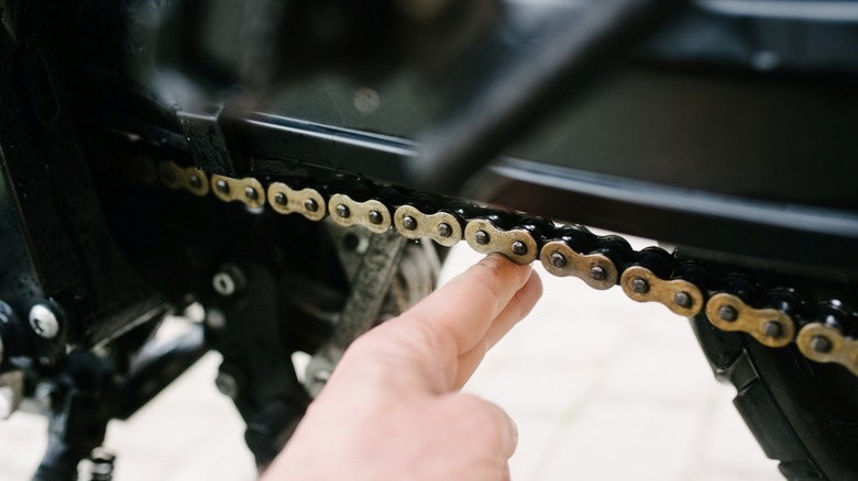 Checking motorcycle chain slack