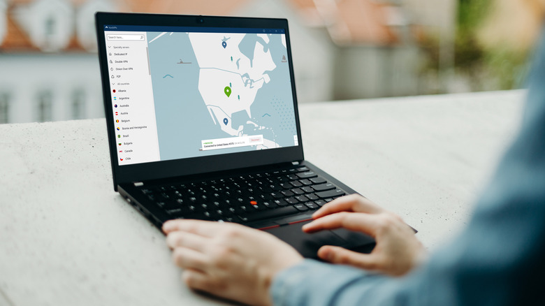 Person using NordVPN on laptop