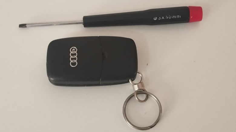 Audi key fob with small flatheaded screwdriver