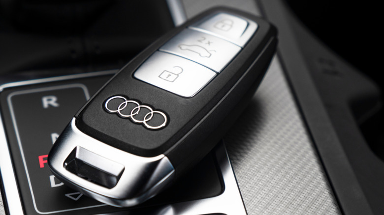 Audi key fob pictured in car on top of shifter