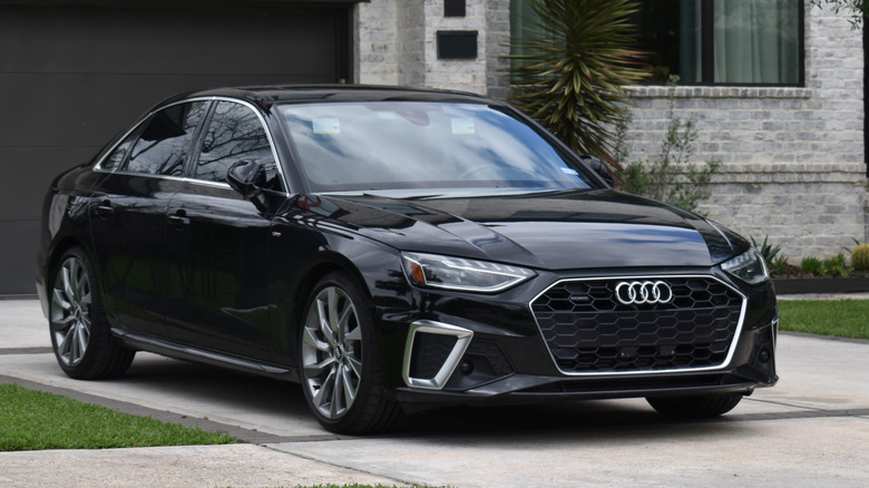 An Audi sedan car parked safely on a flat level surface