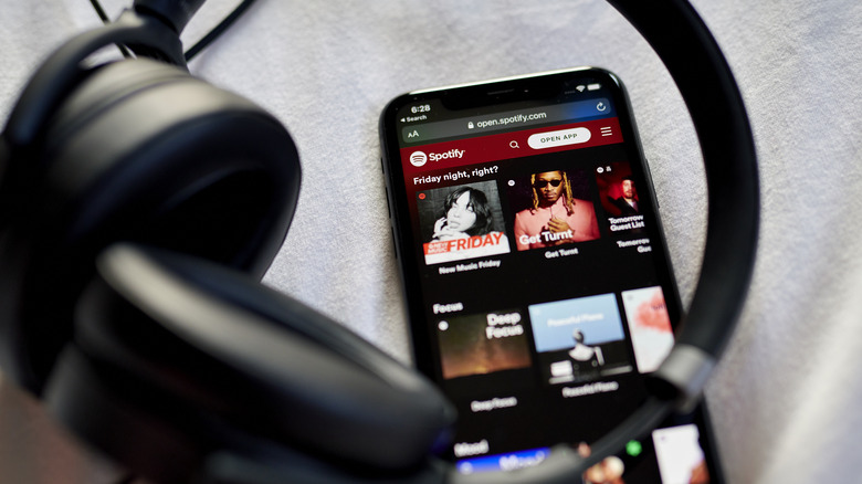 Spotify app on iPhone with headphones