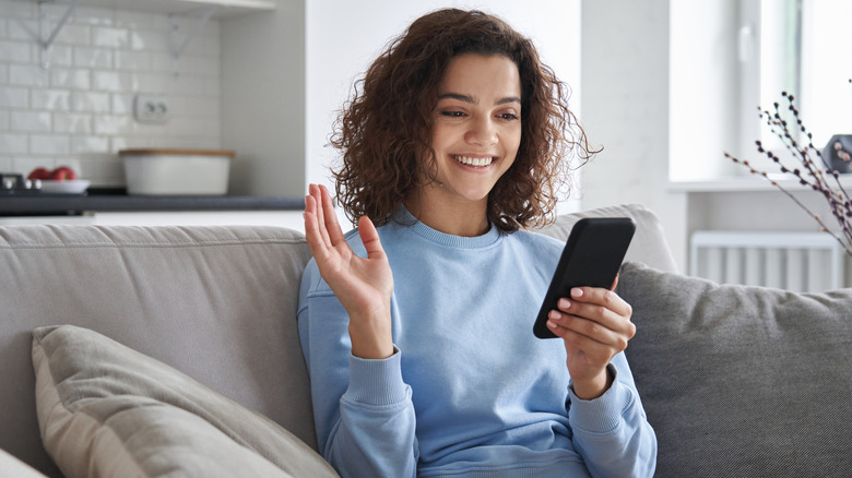 Woman looks at phone