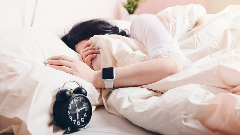 Person sleeping while wearing a smartwatch