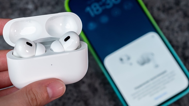 airpods being paired with a phone