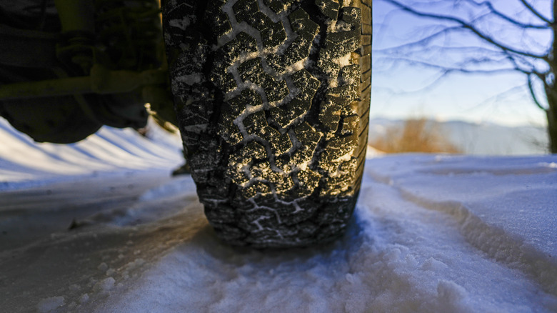 Car tire with tread depth on rough road