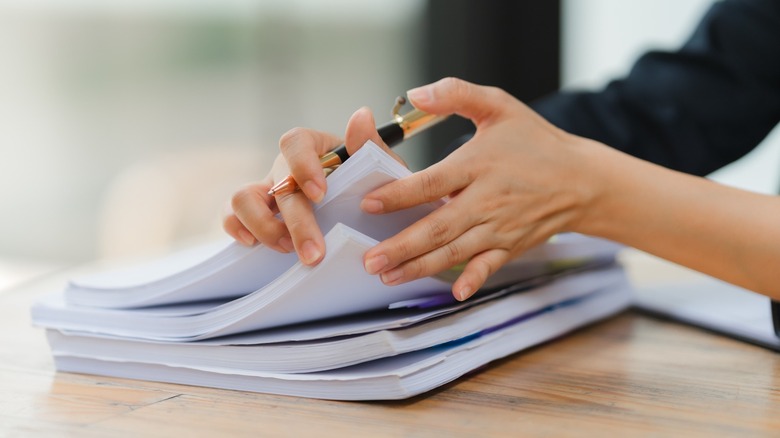 Close up shot of a woman reviewing a document.