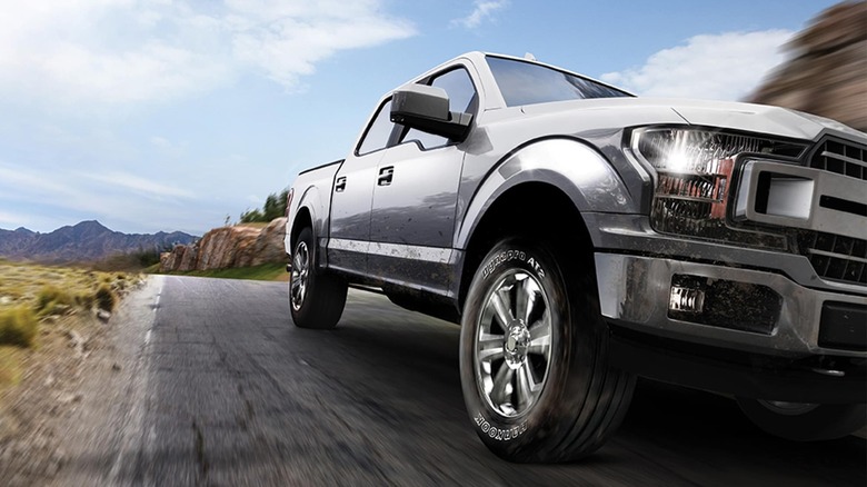 touched-up promotional photo of a truck driving on the road with Hankook DynaPro AT2 tires