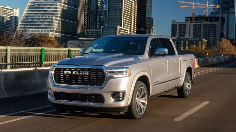 silver 2025 Ram 1500 driving on road