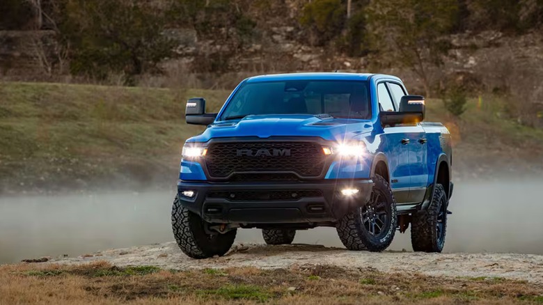 blue 2025 Ram 1500 with headlights on