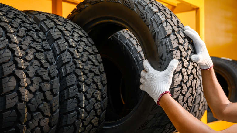 Person lifting tire