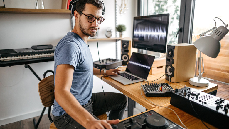 Man in home music studio