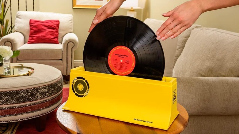 Bruce Springsteen record in Spin Clean operated by a woman's hands