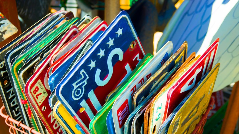 A basket full of old license plates