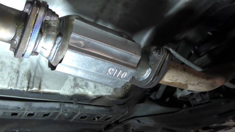 A new catalytic converter on a car after a replacement