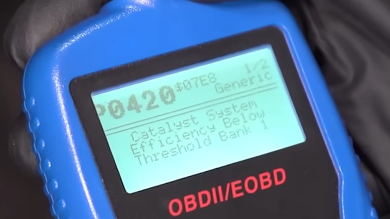 An OBDII scan tool showing a P0420 code