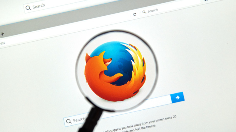 Magnifying glass over Firefox logo