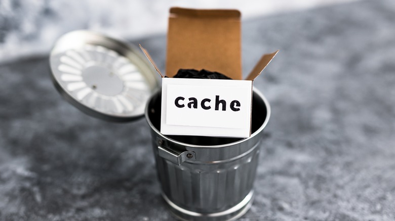 tiny cache box in trash