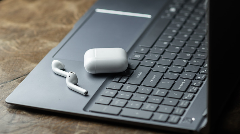 AirPods on a laptop's keyboard