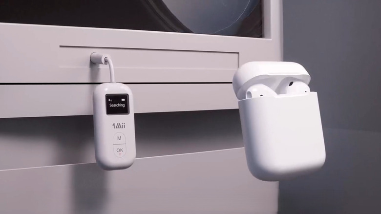 Bluetooth audio transmitter connected with AirPods in case in front