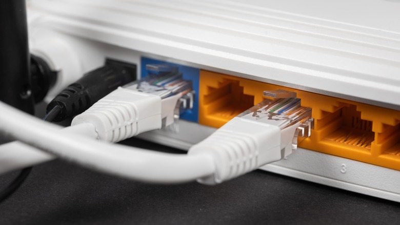 The back of a router showing the Ethernet cables connected