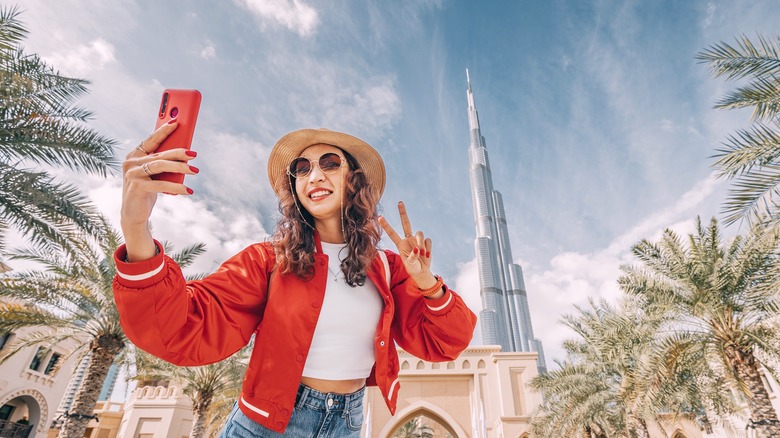 Woman taking selfie traveling