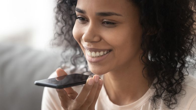 Woman using Siri on iPhone