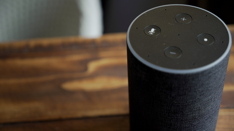 Amazon Echo speaker on wooden table