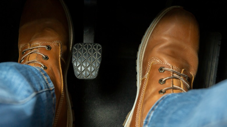 feet around car pedals