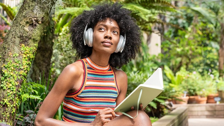 woman wearing Bose headphones