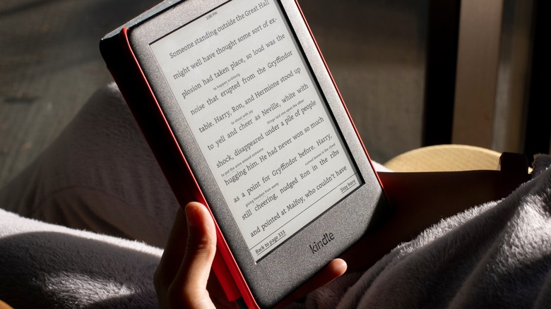 Person reading on Amazon Kindle