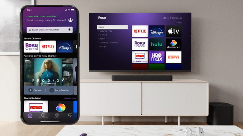 Showing Roku app on one side and the Roku TV in a living room in the background