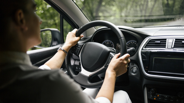 Driver holding the steering wheel