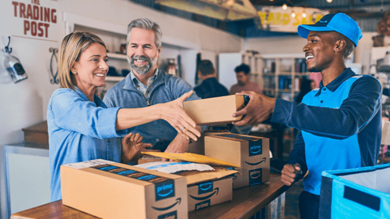 Amazon delivery driver dropping off packages to a business