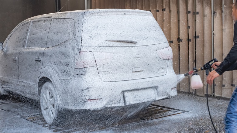 A man washing a car