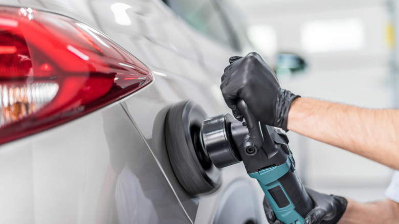 Man polishing a car