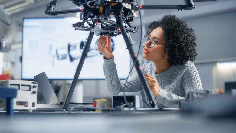 Woman working on a drone